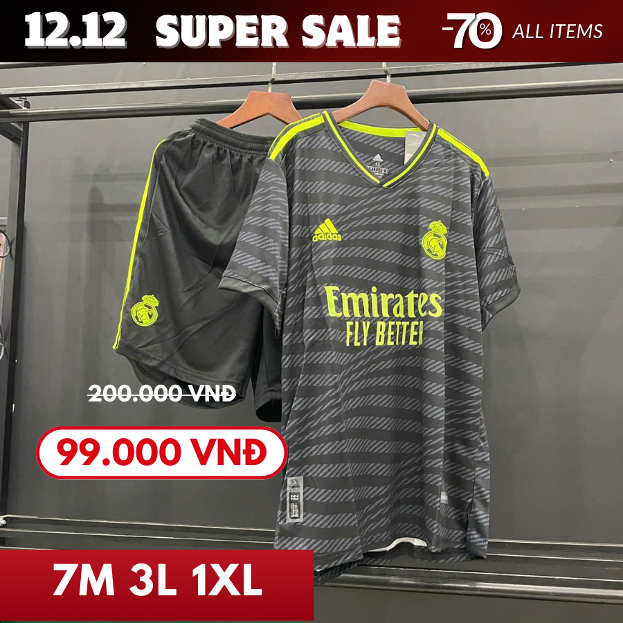 REAL SÂN KHÁCH MÀU ĐEN HỌA TIẾT XANH LÁ 22/23